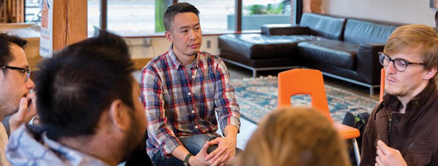 Seattle Pacific Seminary professor Dr. David Leong listening to a student in his seminary class.